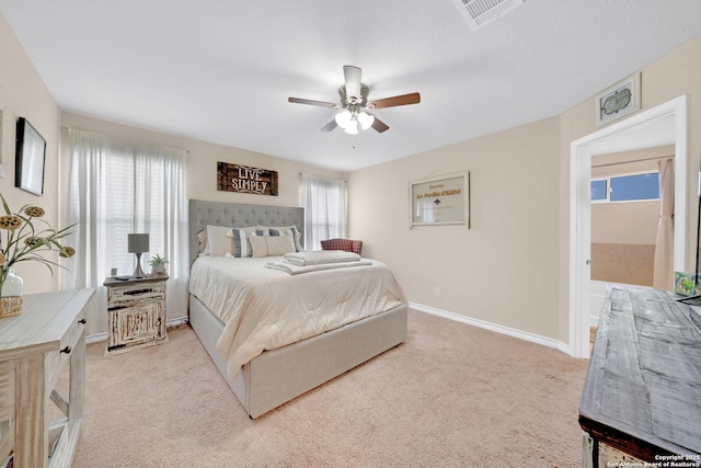 5903 Overture Dawn, San Antonio, TX 78252 - bedroom with light colored carpet, baseboards, and ceiling fan