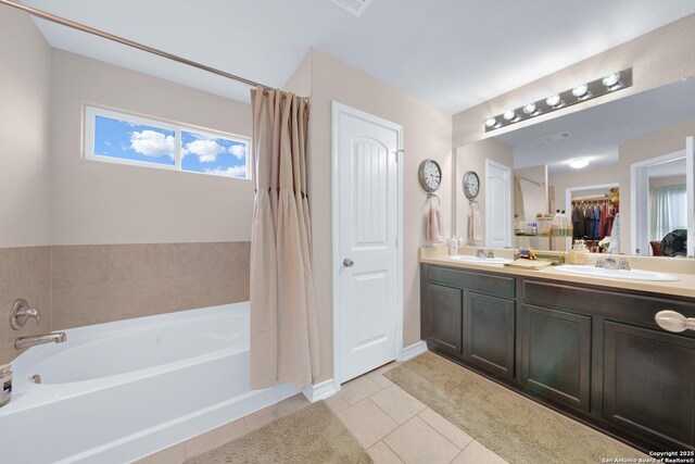 5903 Overture Dawn, San Antonio, TX 78252 - bathroom featuring a bath, double vanity, tile patterned floors, and a shower with shower curtain