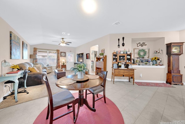 5903 Overture Dawn, San Antonio, TX 78252 - dining area with arched walkways, vaulted ceiling, light tile patterned floors, a ceiling fan, and baseboards