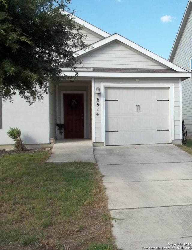 6914 Cozy, San Antonio, TX 78218 - view of front facade with concrete driveway