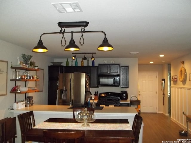 6914 Cozy, San Antonio, TX 78218 - dining space featuring wood finished floors and recessed lighting