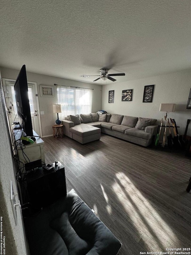 6914 Cozy, San Antonio, TX 78218 - living area featuring a textured ceiling, wood finished floors, and a ceiling fan
