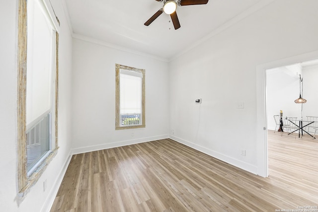 1526 Saint Marys, San Antonio, TX 78210 - spare room with light wood finished floors, crown molding, ceiling fan, and baseboards