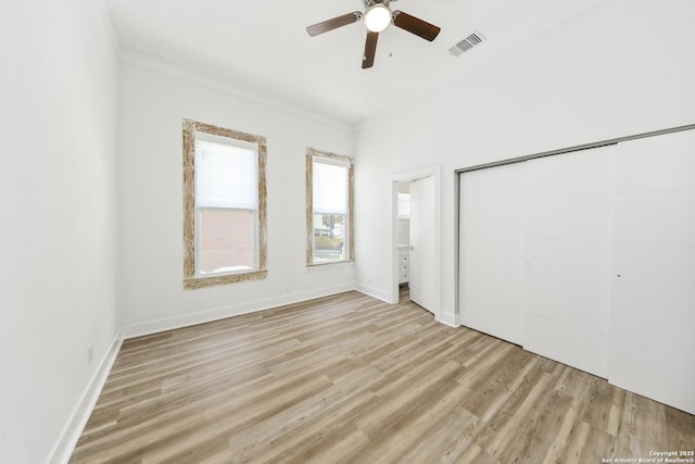 1526 Saint Marys, San Antonio, TX 78210 - unfurnished bedroom with light wood-style flooring, a closet, baseboards, ornamental molding, and a ceiling fan