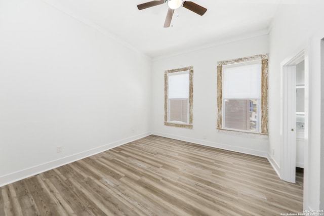 1526 Saint Marys, San Antonio, TX 78210 - spare room featuring ornamental molding, light wood-type flooring, ceiling fan, and baseboards