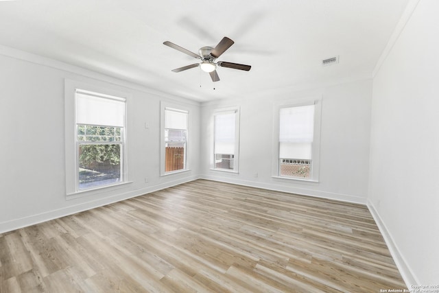 1526 Saint Marys, San Antonio, TX 78210 - spare room with a ceiling fan, light wood-style flooring, baseboards, and ornamental molding