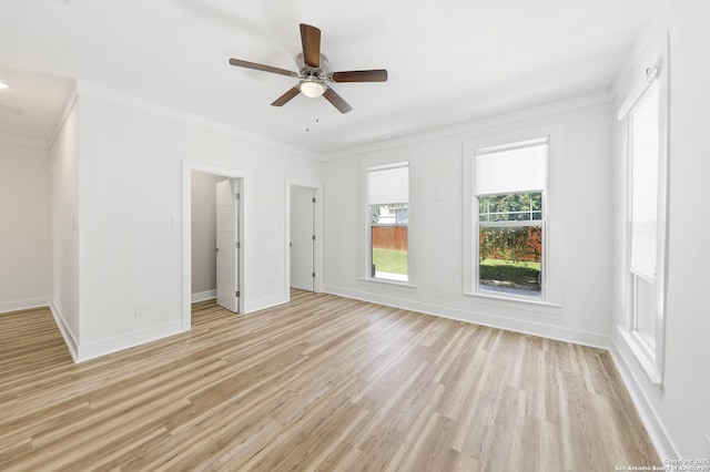 1526 Saint Marys, San Antonio, TX 78210 - spare room featuring crown molding, light wood-style floors, a ceiling fan, and baseboards