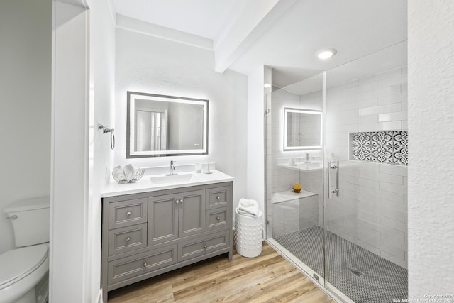 1526 Saint Marys, San Antonio, TX 78210 - bathroom featuring toilet, a shower stall, wood finished floors, and vanity