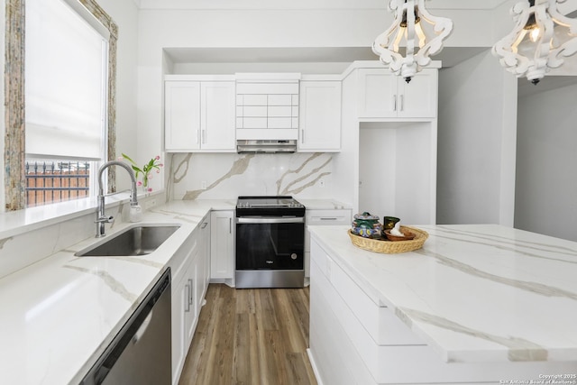 1526 Saint Marys, San Antonio, TX 78210 - kitchen with appliances with stainless steel finishes, a sink, under cabinet range hood, wood finished floors, and white cabinets