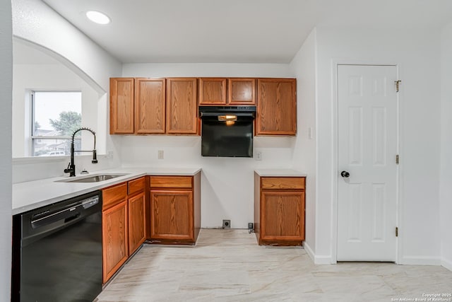7111 Hallie, San Antonio, TX 78227 - kitchen with black appliances, a sink, brown cabinetry, and light countertops
