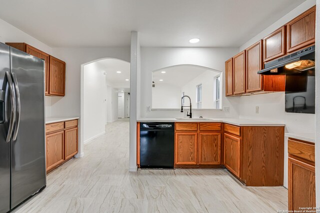 7111 Hallie, San Antonio, TX 78227 - kitchen with stainless steel fridge, dishwasher, a sink, arched walkways, and recessed lighting