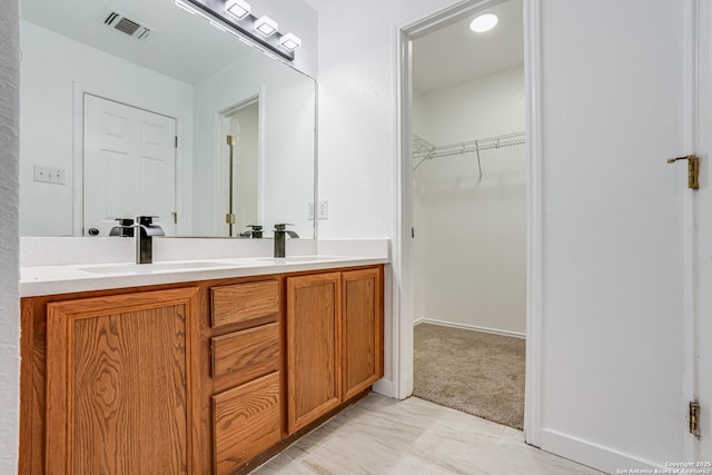 7111 Hallie, San Antonio, TX 78227 - bathroom with double vanity and a walk in closet