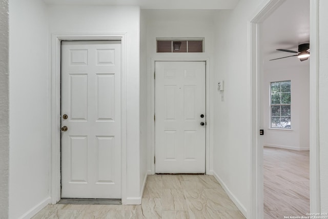 7111 Hallie, San Antonio, TX 78227 - entryway featuring baseboards, a ceiling fan, and light marble finish flooring