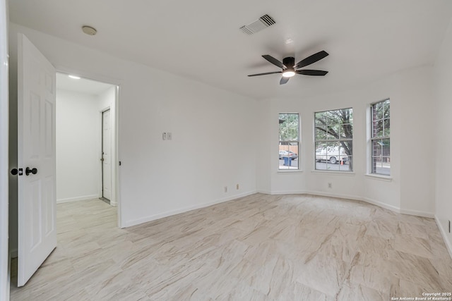 7111 Hallie, San Antonio, TX 78227 - empty room featuring ceiling fan, baseboards, and a smoke detector