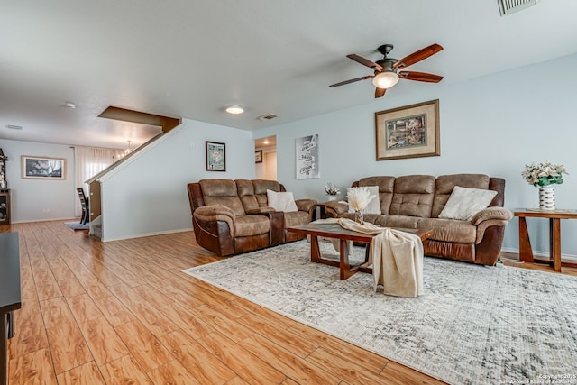 6459 Marlin Flts, San Antonio, TX 78244 - living room with stairway, wood finished floors, ceiling fan, and baseboards