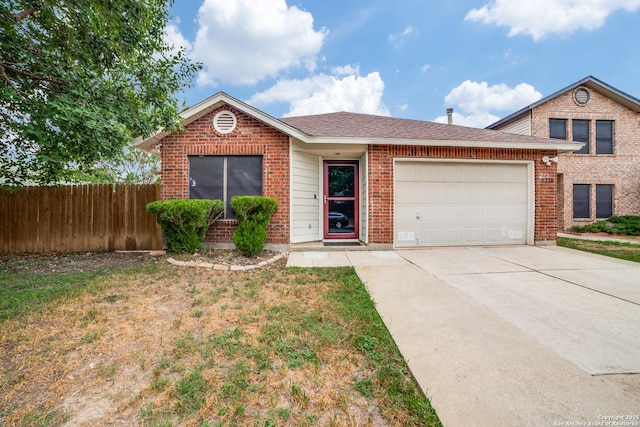 2218 Gunter Bay, San Antonio, TX 78245 - view of front of property with driveway, a garage, brick siding, and a shingled roof