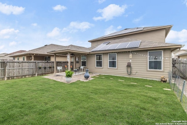8940 Hickman Park, San Antonio, TX 78254 - rear view of house featuring roof mounted solar panels and a patio area
