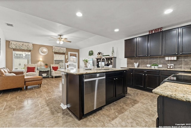 8940 Hickman Park, San Antonio, TX 78254 - kitchen with stainless steel dishwasher, a sink, open floor plan, a ceiling fan, and tasteful backsplash