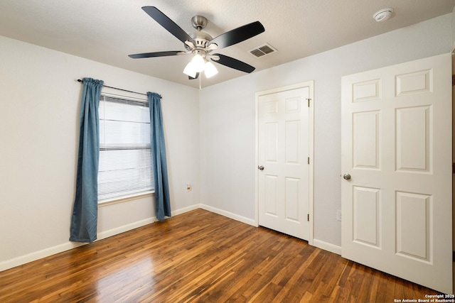 3702 La Sabre Dr, San Antonio, TX 78218 - unfurnished bedroom with wood finished floors, baseboards, and ceiling fan