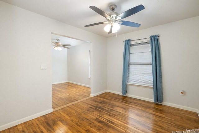 3702 La Sabre Dr, San Antonio, TX 78218 - spare room featuring a ceiling fan, wood finished floors, and baseboards