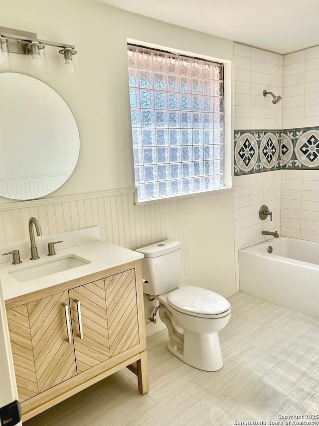 520 Sagecrest Dr, Hollywood Park, TX 78232 - full bath with toilet, washtub / shower combination, vanity, and a wainscoted wall