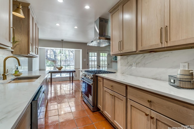 146 Canyon Oaks, Hollywood Park, TX 78232 - kitchen featuring stainless steel stove, wall chimney range hood, a sink, recessed lighting, and tasteful backsplash