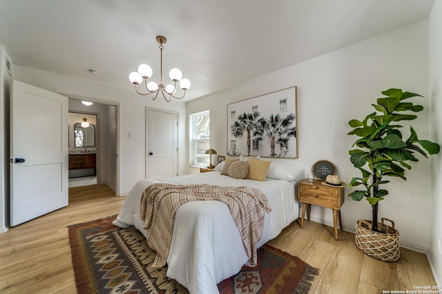146 Canyon Oaks, Hollywood Park, TX 78232 - bedroom with a chandelier, light wood-style flooring, baseboards, and connected bathroom