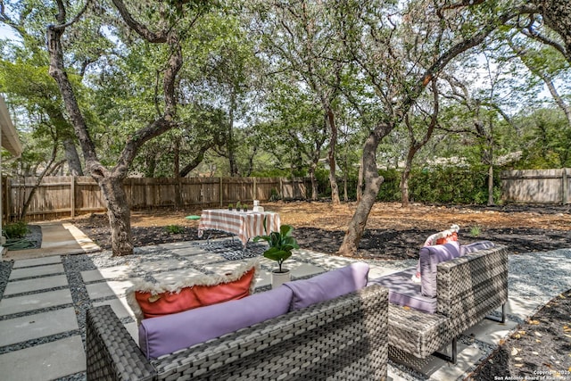 146 Canyon Oaks, Hollywood Park, TX 78232 - fenced backyard featuring a patio area and view of wooded area