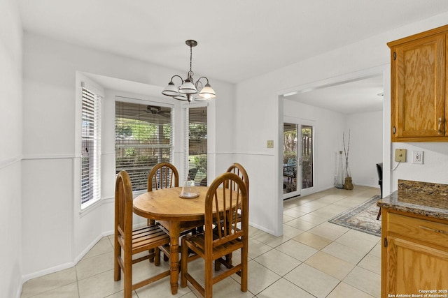 437 Spaceway, Windcrest, TX 78239 - dining space with light tile patterned flooring, a chandelier, and baseboards