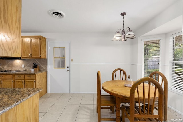 437 Spaceway, Windcrest, TX 78239 - dining space featuring light tile patterned floors, a chandelier, and baseboards