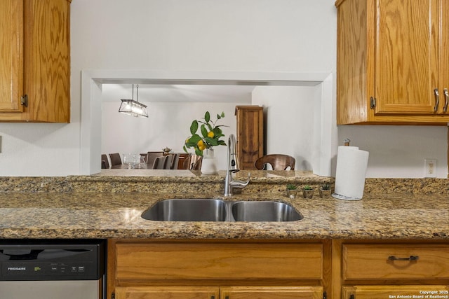 437 Spaceway, Windcrest, TX 78239 - kitchen featuring a sink, stainless steel dishwasher, brown cabinets, and dark stone countertops
