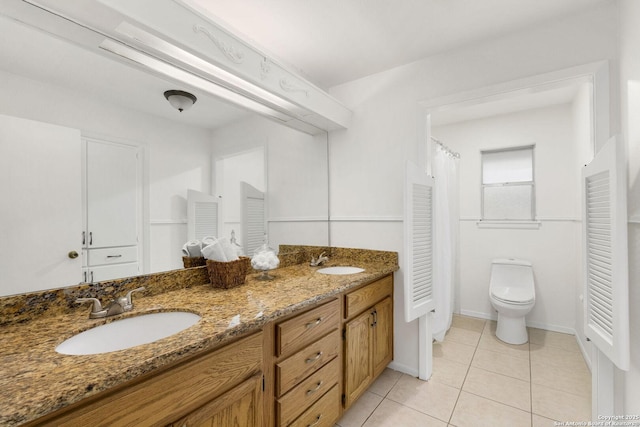 437 Spaceway, Windcrest, TX 78239 - bathroom with double vanity, tile patterned flooring, toilet, and baseboards
