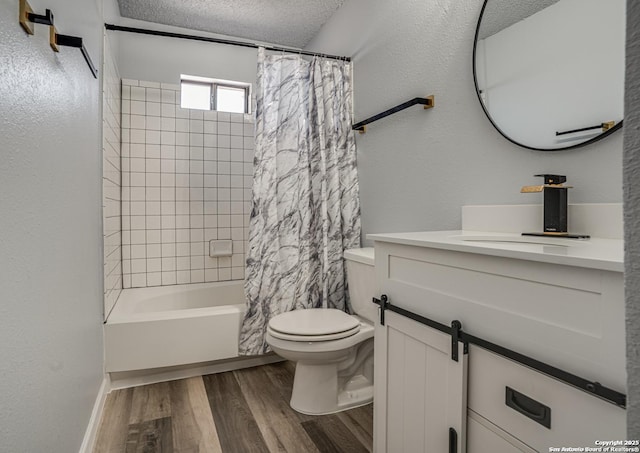 2310 Ruby Oaks, San Antonio, TX 78232 - bathroom featuring vanity, wood finished floors, toilet, shower / tub combo, and a textured ceiling