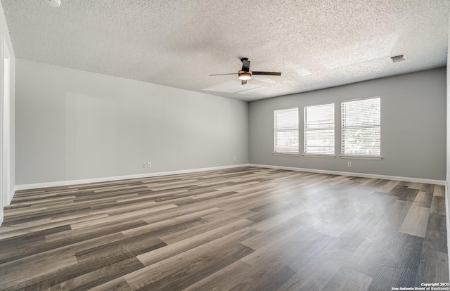 2310 Ruby Oaks, San Antonio, TX 78232 - unfurnished room featuring ceiling fan, a textured ceiling, wood finished floors, and baseboards