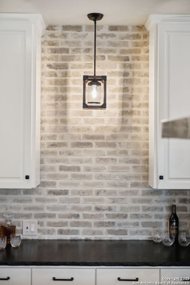 2803 River Way, Spring Branch, TX 78070 - kitchen featuring dark countertops and white cabinets