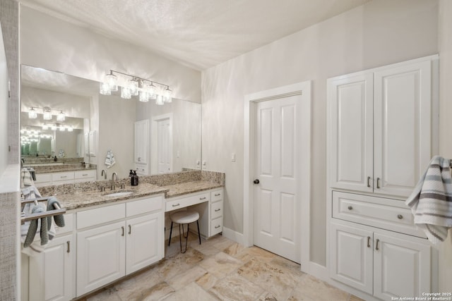 2803 River Way, Spring Branch, TX 78070 - bathroom with vanity and baseboards