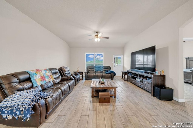 2015 Sisyphus, San Antonio, TX 78245 - living area featuring a ceiling fan, light wood-type flooring, baseboards, and arched walkways