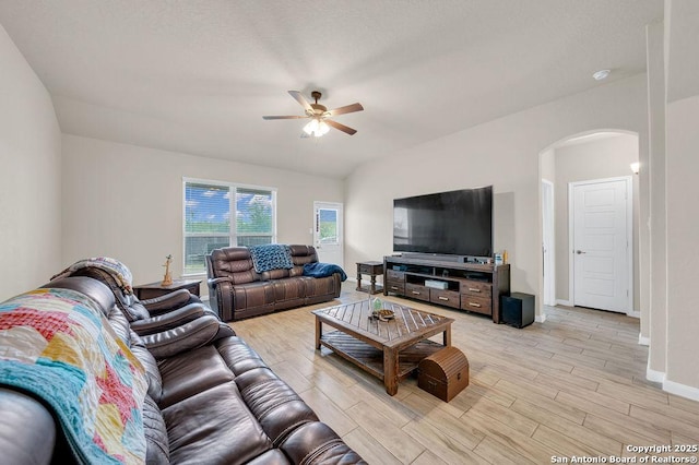 2015 Sisyphus, San Antonio, TX 78245 - living area with arched walkways, a ceiling fan, light wood-type flooring, and baseboards