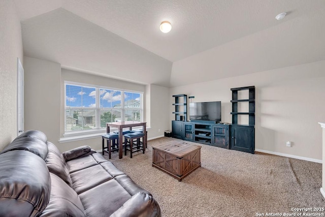 2015 Sisyphus, San Antonio, TX 78245 - carpeted living area with baseboards and vaulted ceiling