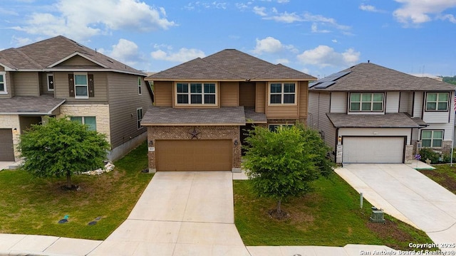 2015 Sisyphus, San Antonio, TX 78245 - view of front of property featuring an attached garage, concrete driveway, brick siding, and a front yard
