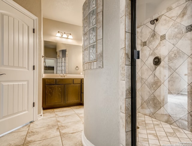 12118 Fort Leaton, San Antonio, TX 78254 - bathroom with a shower stall, vanity, and tile patterned flooring