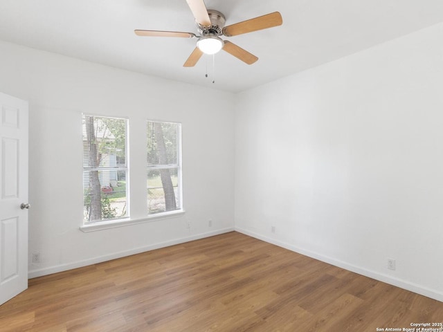 427 Goodrich, San Antonio, TX 78201 - empty room featuring wood finished floors, baseboards, and a ceiling fan