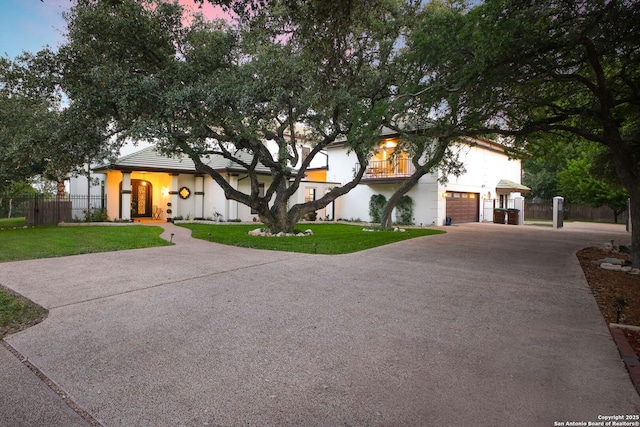 625 Paseo Canada, San Antonio, TX 78232 - view of front facade with stucco siding, driveway, a balcony, and a garage