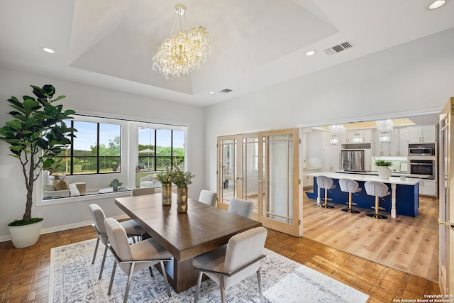 625 Paseo Canada, San Antonio, TX 78232 - dining room with a chandelier, a raised ceiling, recessed lighting, baseboards, and a towering ceiling