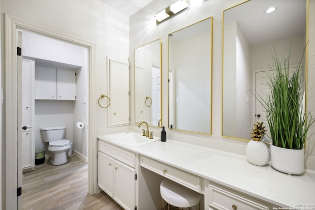625 Paseo Canada, San Antonio, TX 78232 - bathroom with toilet, vanity, and wood finished floors
