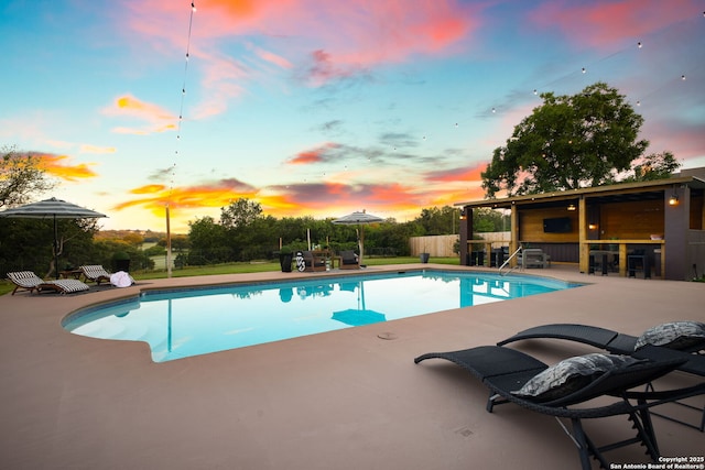625 Paseo Canada, San Antonio, TX 78232 - pool at dusk with a patio area and an outdoor pool