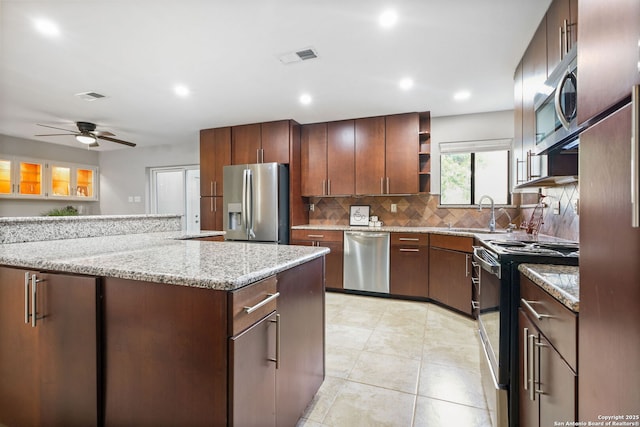625 Paseo Canada, San Antonio, TX 78232 - kitchen with stainless steel appliances, a sink, tasteful backsplash, a ceiling fan, and open shelves