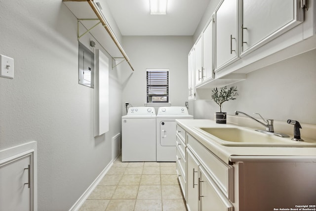 625 Paseo Canada, San Antonio, TX 78232 - laundry room featuring washing machine and clothes dryer, cabinet space, baseboards, electric panel, and light tile patterned flooring