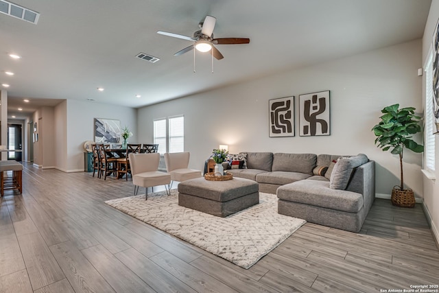 10206 Daylily, Boerne, TX 78006 - living room with wood finished floors, ceiling fan, baseboards, and recessed lighting