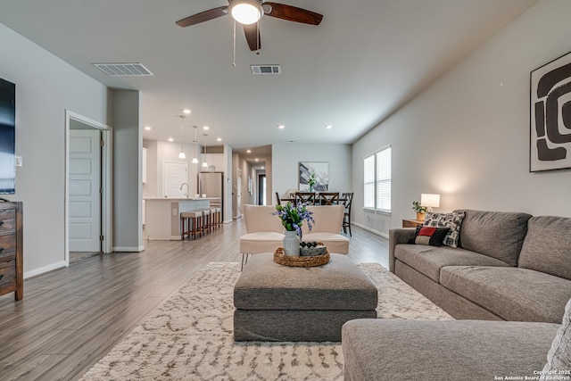 10206 Daylily, Boerne, TX 78006 - living area with a ceiling fan, light wood-type flooring, baseboards, and recessed lighting